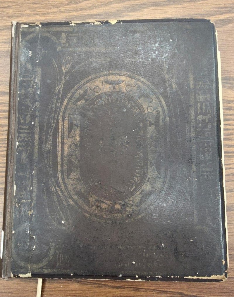 C067 original brown-and-gold publisher-issued front board