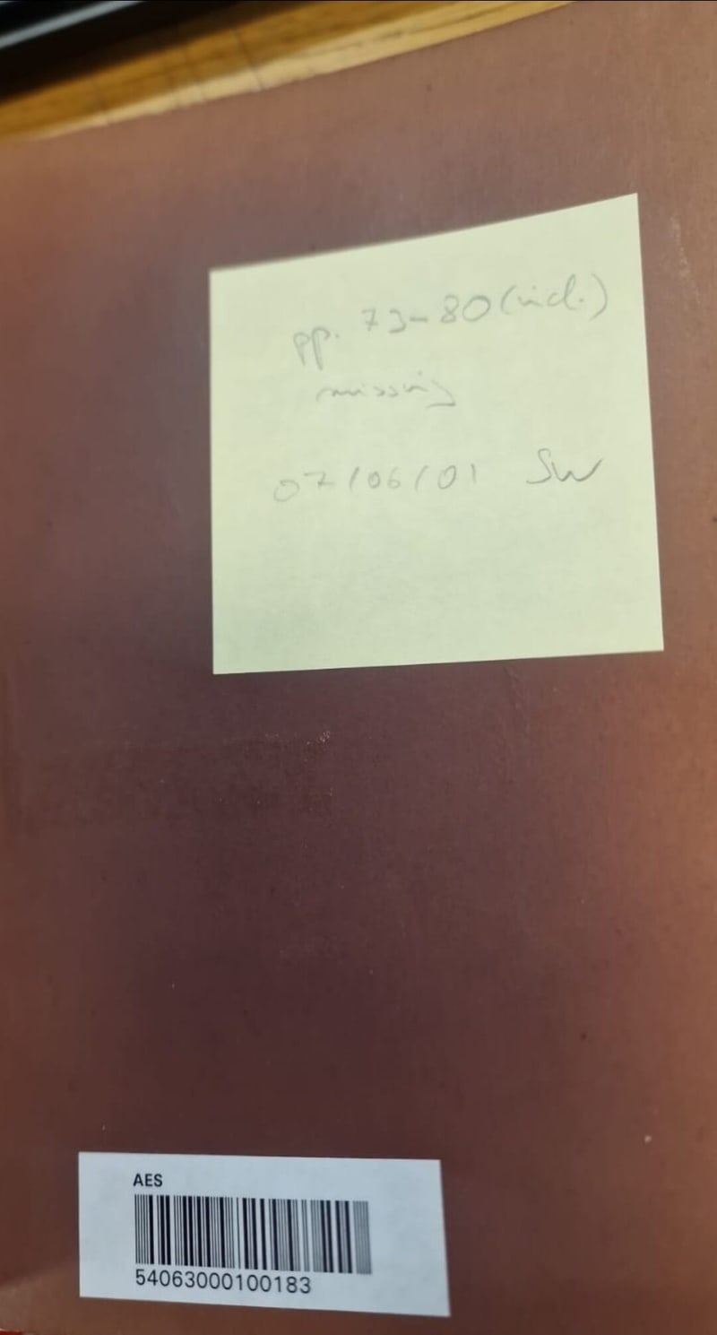 C083 plain brown cloth board of the later library binding with an adhesive note and barcode label
