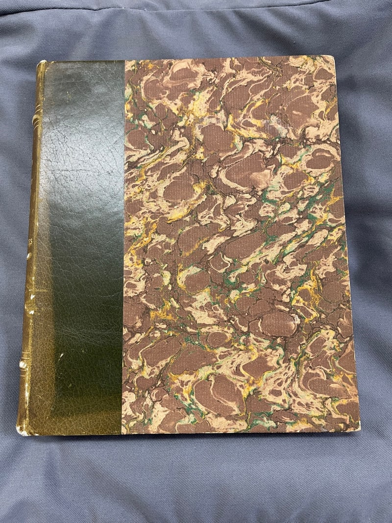 C091: Later half binding: dark green leather band and marbled paper side